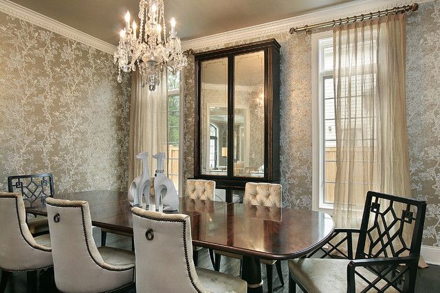 Times appeal in this dining room enveloped in metallic wallpaper