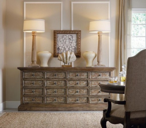 A dining room with a dresser and lamps transformed by paint.