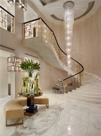 A flowing chandelier highlights this stairwell 
