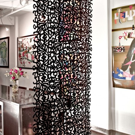 A black and white patterned room divider.