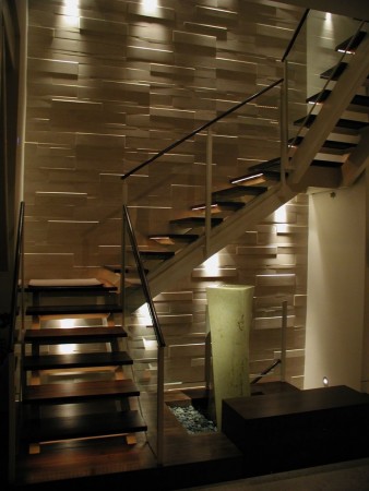 Wall lights provide targeted illumination on the stairwell