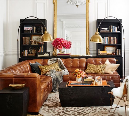 A living room with versatile brown leather furniture.