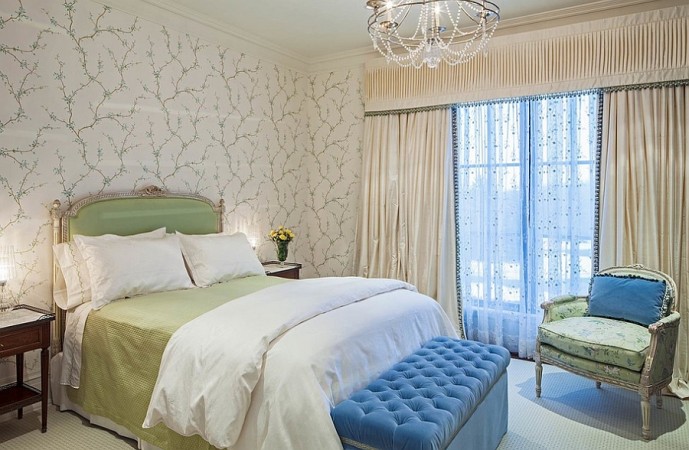 Soft colors enhance this feminine bedroom