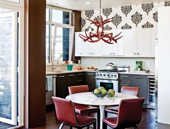 A red antler chandelier is an unexpected feature in this kitchen