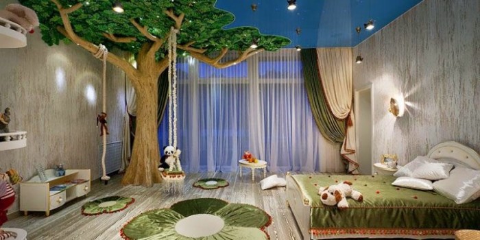 A kids' room with a tree on the ceiling.