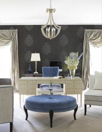 A stylish home office with blue accents and a desk to inspire.