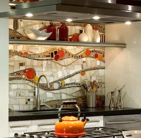 A kitchen with a tiled backsplash.