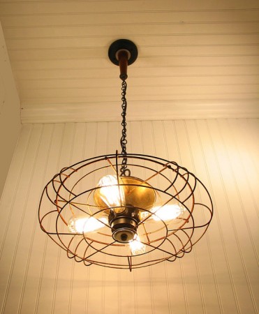 Old fan repurposed into a light fixture