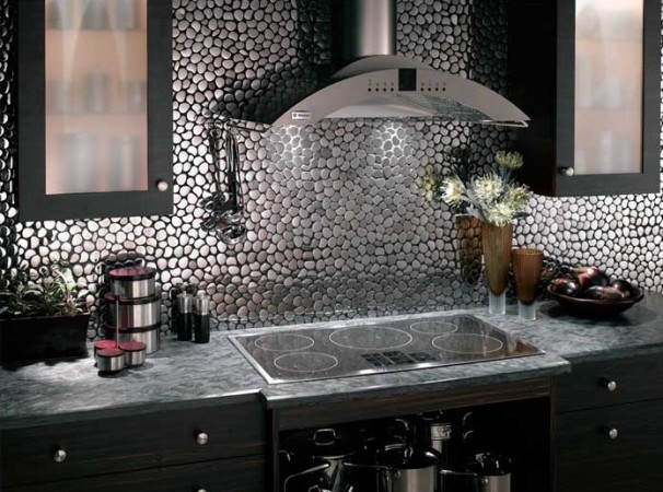 A kitchen with a beautiful black and silver backsplash to add character.
