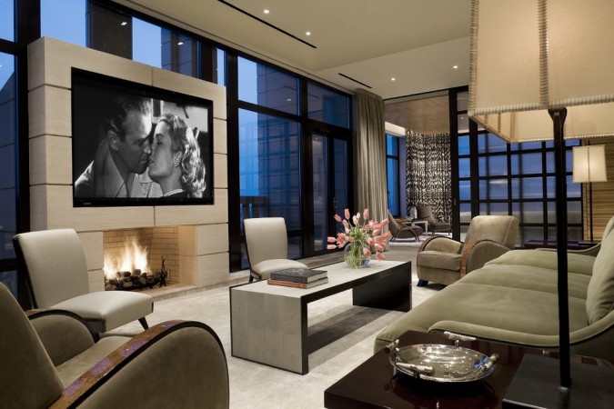 A living room with a fireplace and large windows can be refreshed after the holidays.