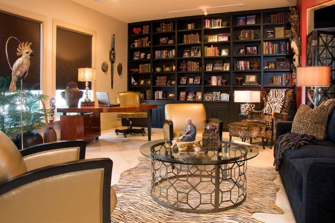 A stylish living room with bookshelves and a coffee table.