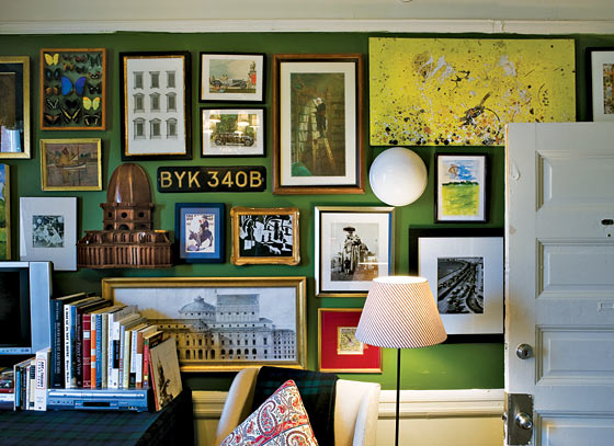 Unique items alongside prints and photos make a gallery wall interesting 