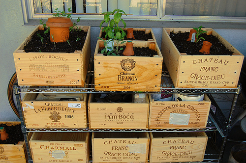 Use wood crates in the garden for storage and planting 