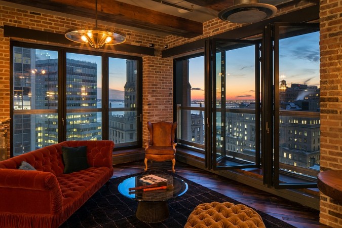 A city apartment with large windows overlooking the city.