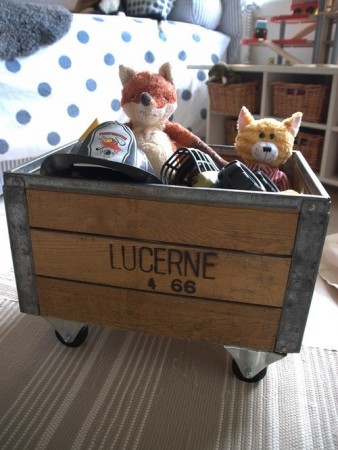 Create a rolling toy chest with a repurposed wood crate 