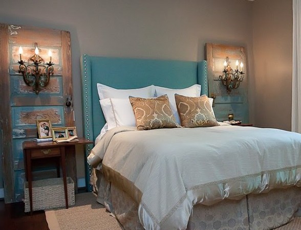 Wall sconces enhance old doors in the bedroom 