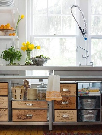 A kitchen with lots of repurposed wood crates and baskets.
