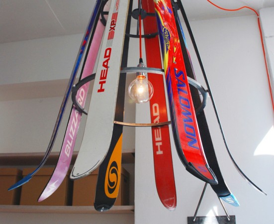 A unique light fixture repurposed with skis.