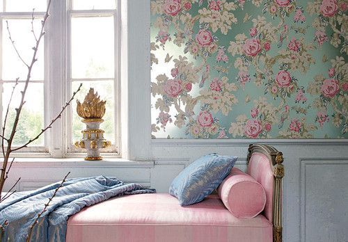 A room with a pink bed and floral wallpaper featuring 2016's Colors of the Year.