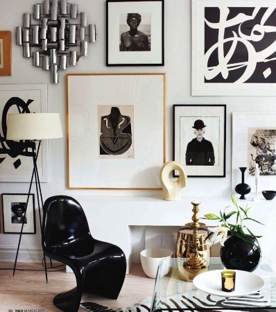 Photographs, prints and metal art accent this gallery wall 