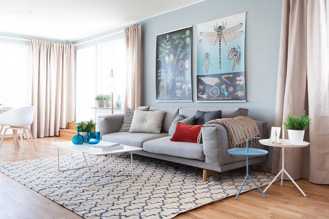 Hints of rose quartz and serenity blue soften this living room 