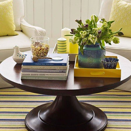 Books create varying heights in table vignette 