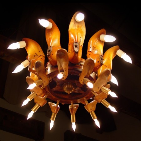 A repurposed light fixture with 22 unique wooden chandelier lights.