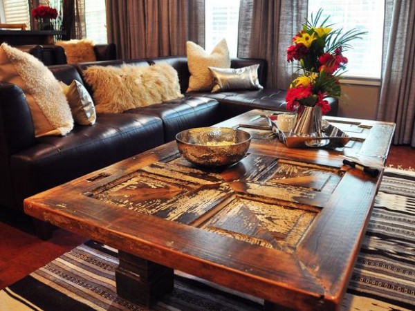 A living room with a wooden door coffee table.
