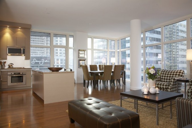 How to style a living room and dining room with large windows in a beautiful city apartment.