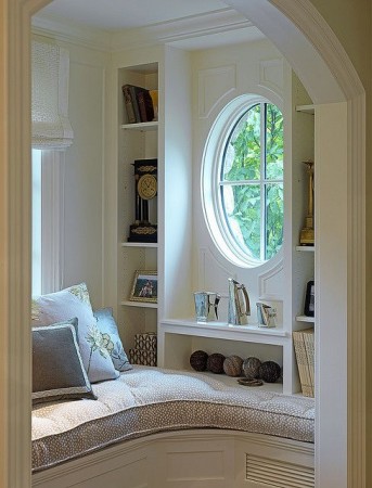 A cozy nook with an arched window.