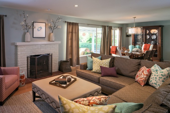 Colorful throw pillows enhance this neutral living room 