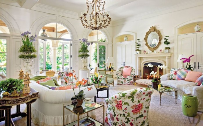 A Bold and Beautiful living room with floral furniture and a chandelier, inspired by Palm Beach Style.