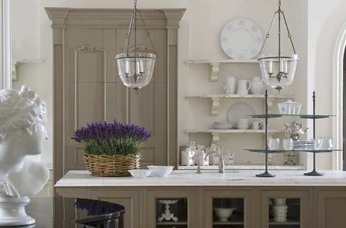 Create French Charm in Your Kitchen With a Marble Counter top and Vase of Flowers.
