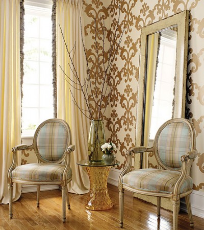 Two chairs in front of a mirror adding shimmer to your home.