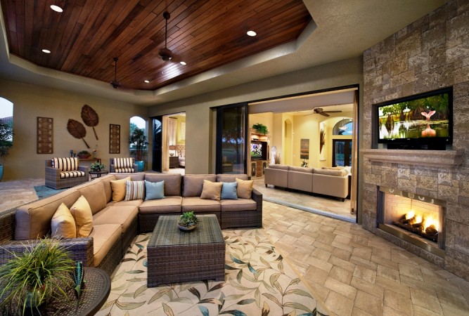 A luxurious living room featuring a fireplace and tv.