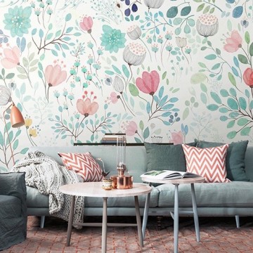 A colorful living room with floral wallpaper.