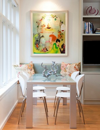 A quaint breakfast nook is created with a window seat