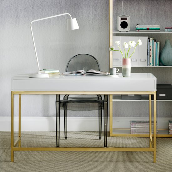 A white and gold affordable ikea desk in a home office.