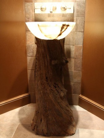 An onyx sink mounted on a log