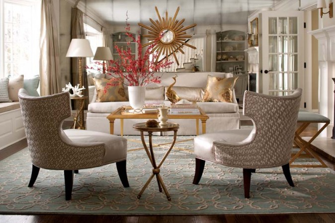 A living room with two chairs and a mirror showcasing great ways to add shimmer and luster to your home.