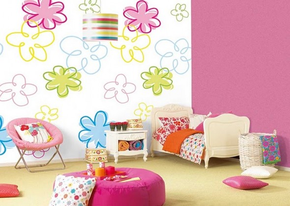 A girl's room with vibrant floral wall designs.