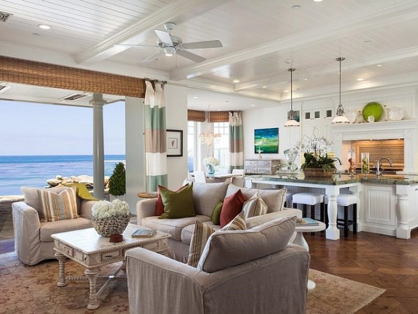 A living room with a chic beach view.