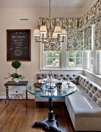 Create a charming bistro-style dining room with a glass table and chairs.