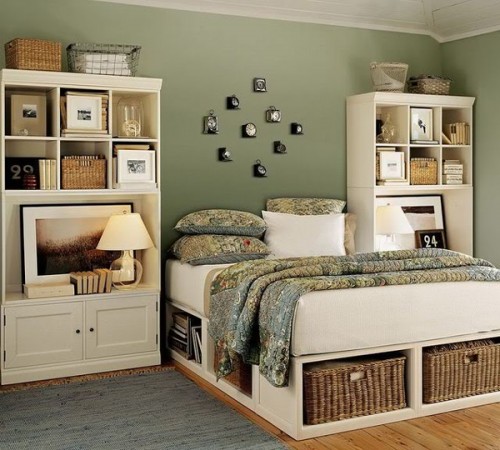 A bedroom with wicker baskets on the floor.