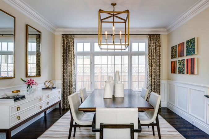 The Formal Dining Room Is Making a Comeback with white chairs.