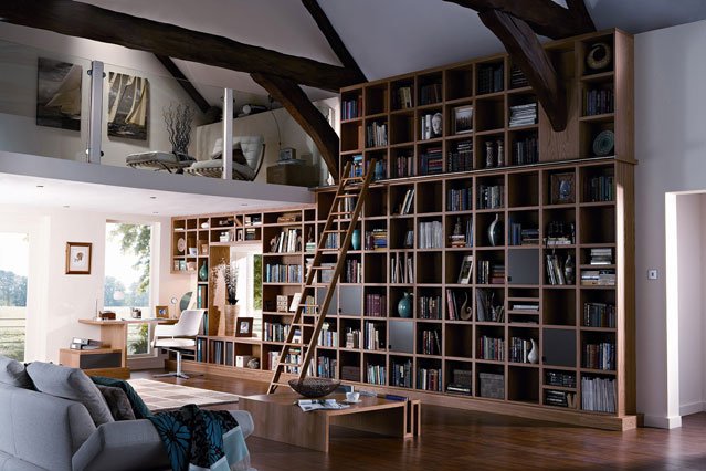 A wall of bookcases is the focal point in this interior