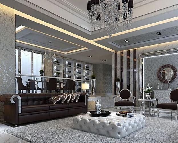 A Gatsby-style living room with white furniture and a chandelier.