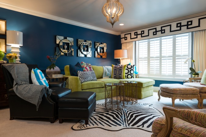 Bold walls and a bright green sofa give this room a boost 