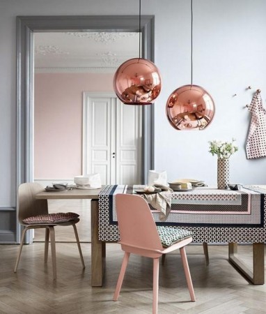 A dining room with a pink table and chairs adds shimmer and luster to your home.