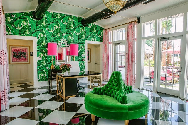 A bold and beautiful room with a green and black checkered floor, inspired by Palm Beach style.